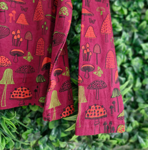 Long sleeved red mushroom tshirt.