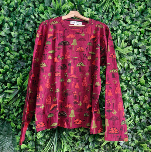 Long sleeved red mushroom tshirt.