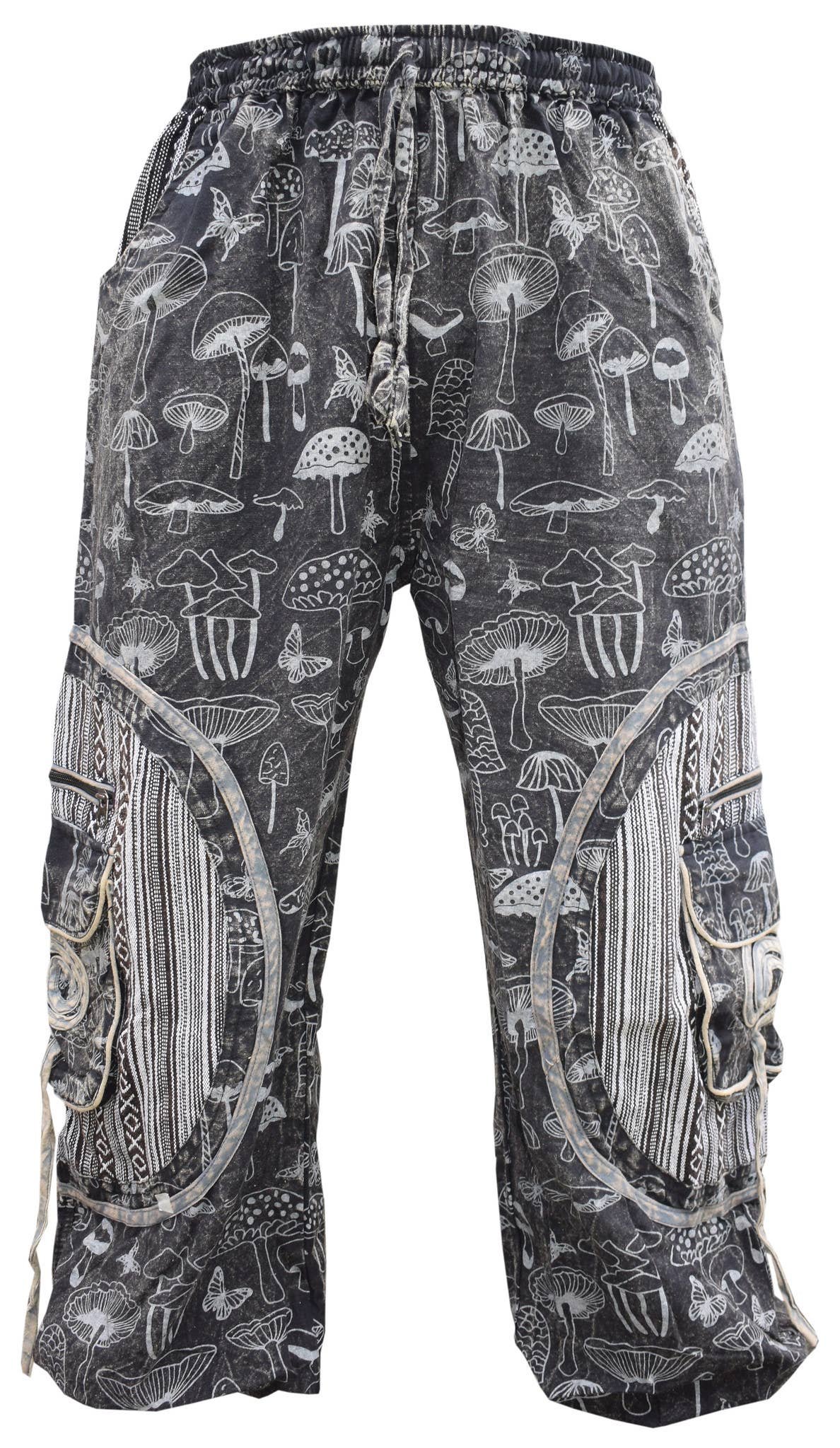 Mushroom Print Chakra Trousers black front Black mushroom print chakra trousers, front view, with white and grey striped panels and chakra swirl pockets on both legs
